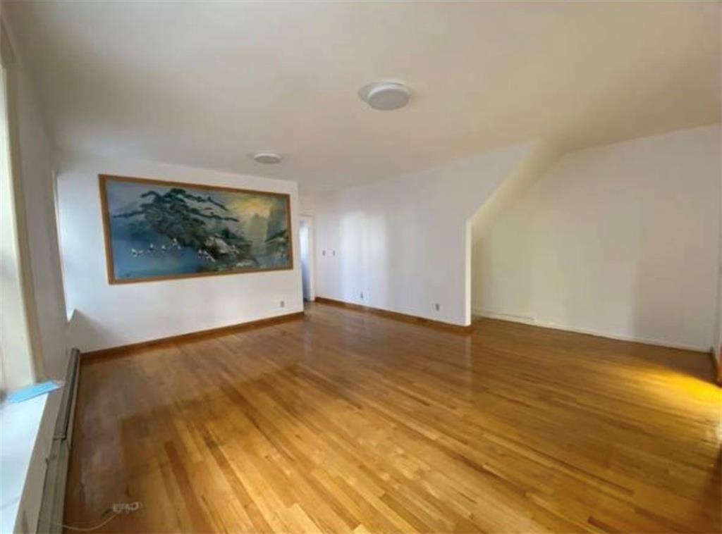 352 68th Street Brooklyn, NY 11220 - Photo 6 of 14 a view of empty room with wooden floor