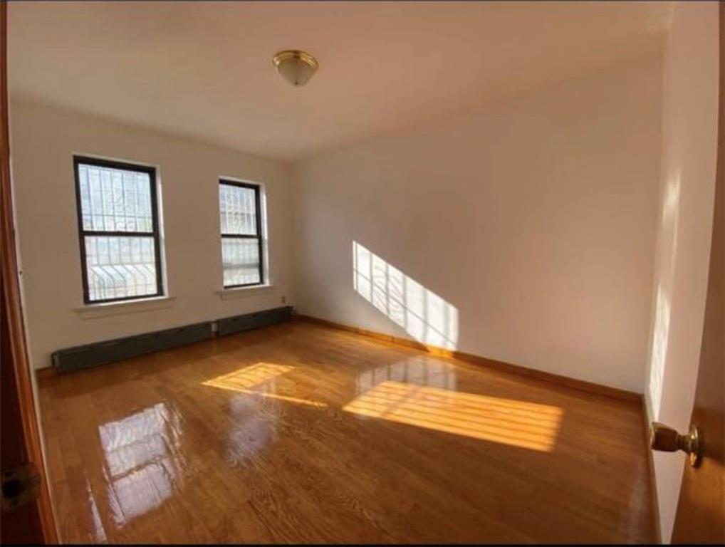 352 68th Street Brooklyn, NY 11220 - Photo 10 of 14 an empty room with windows
