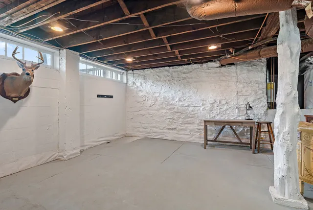a balcony with furniture and a potted plant