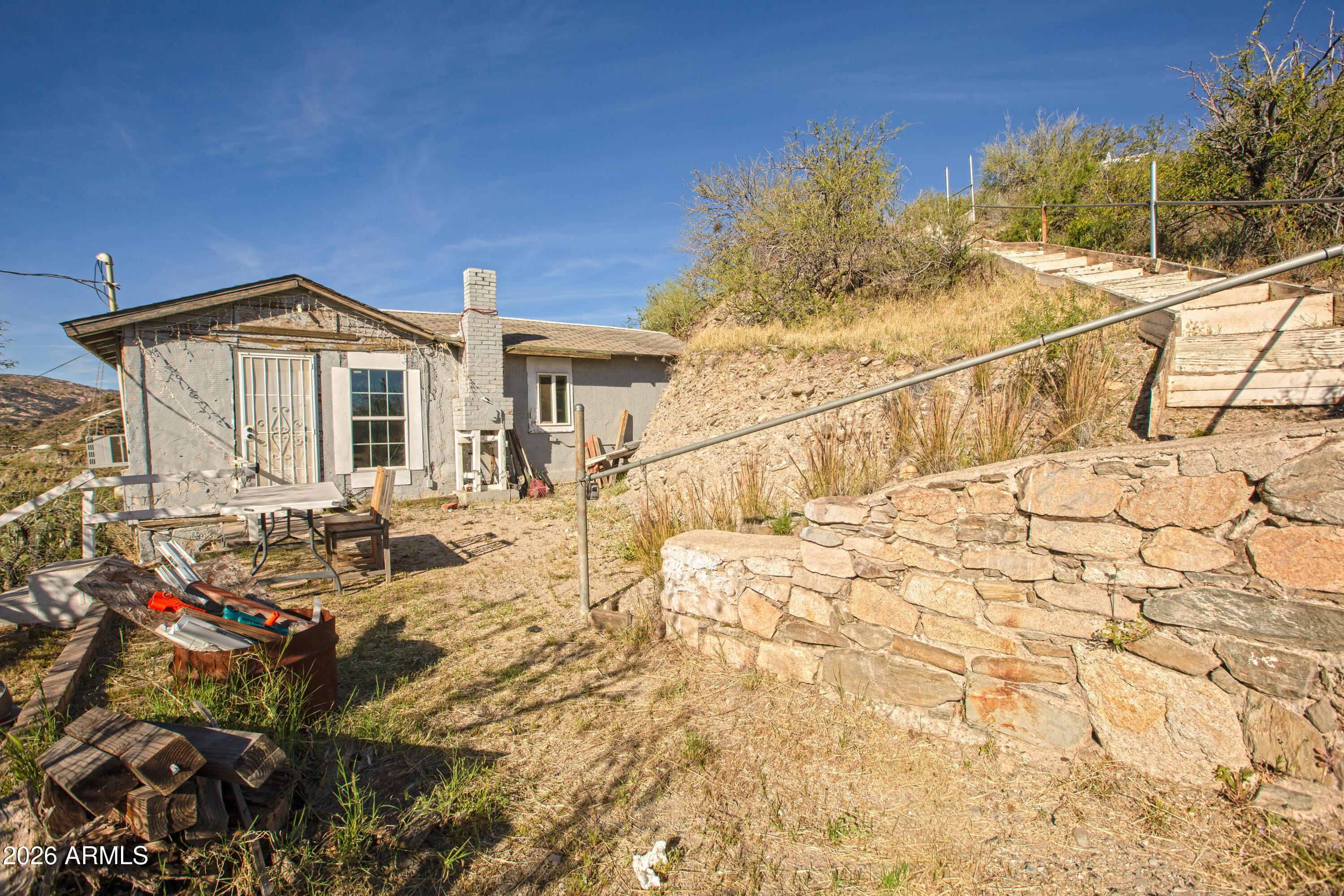 512 West Pinto Street Miami, AZ 85539 - Photo 2 of 27 a view of a house with a yard