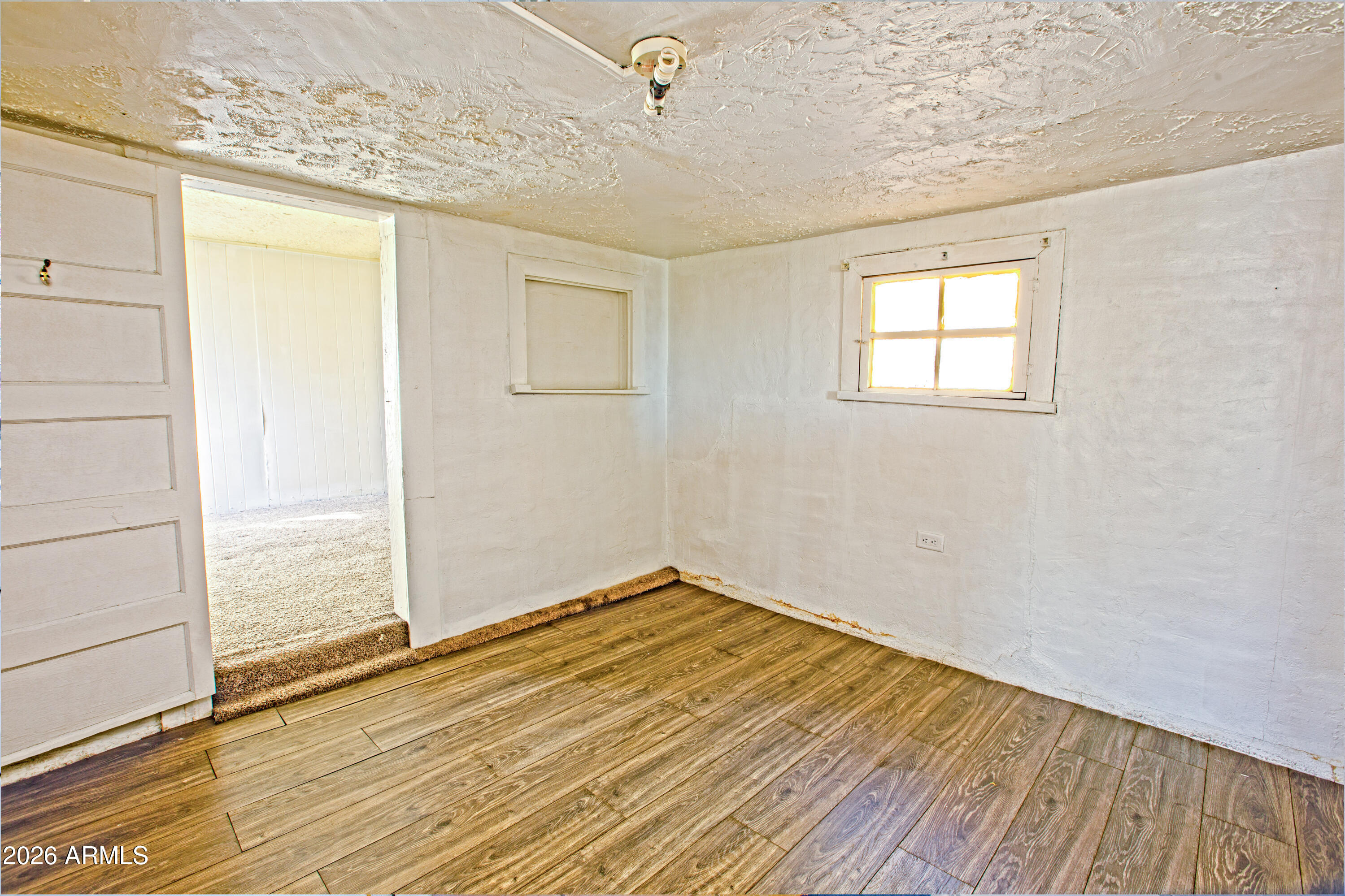512 West Pinto Street Miami, AZ 85539 - Photo 24 of 27 a view of a room with wooden floor