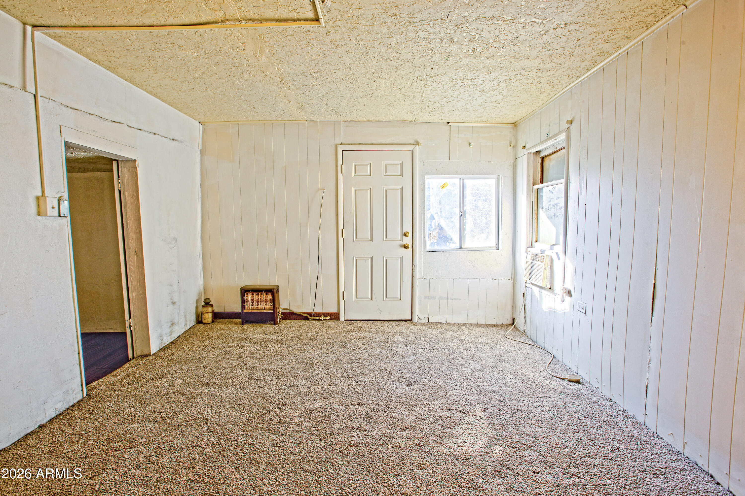512 West Pinto Street Miami, AZ 85539 - Photo 26 of 27 a view of empty room with wooden floor and fan