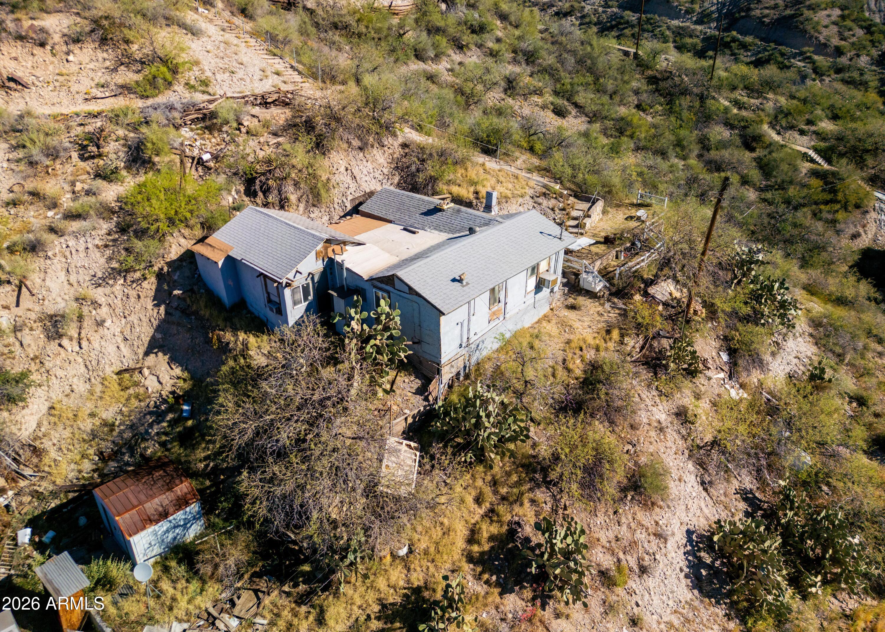 512 West Pinto Street Miami, AZ 85539 - Photo 6 of 27 an aerial view of a house with yard and outdoor seating