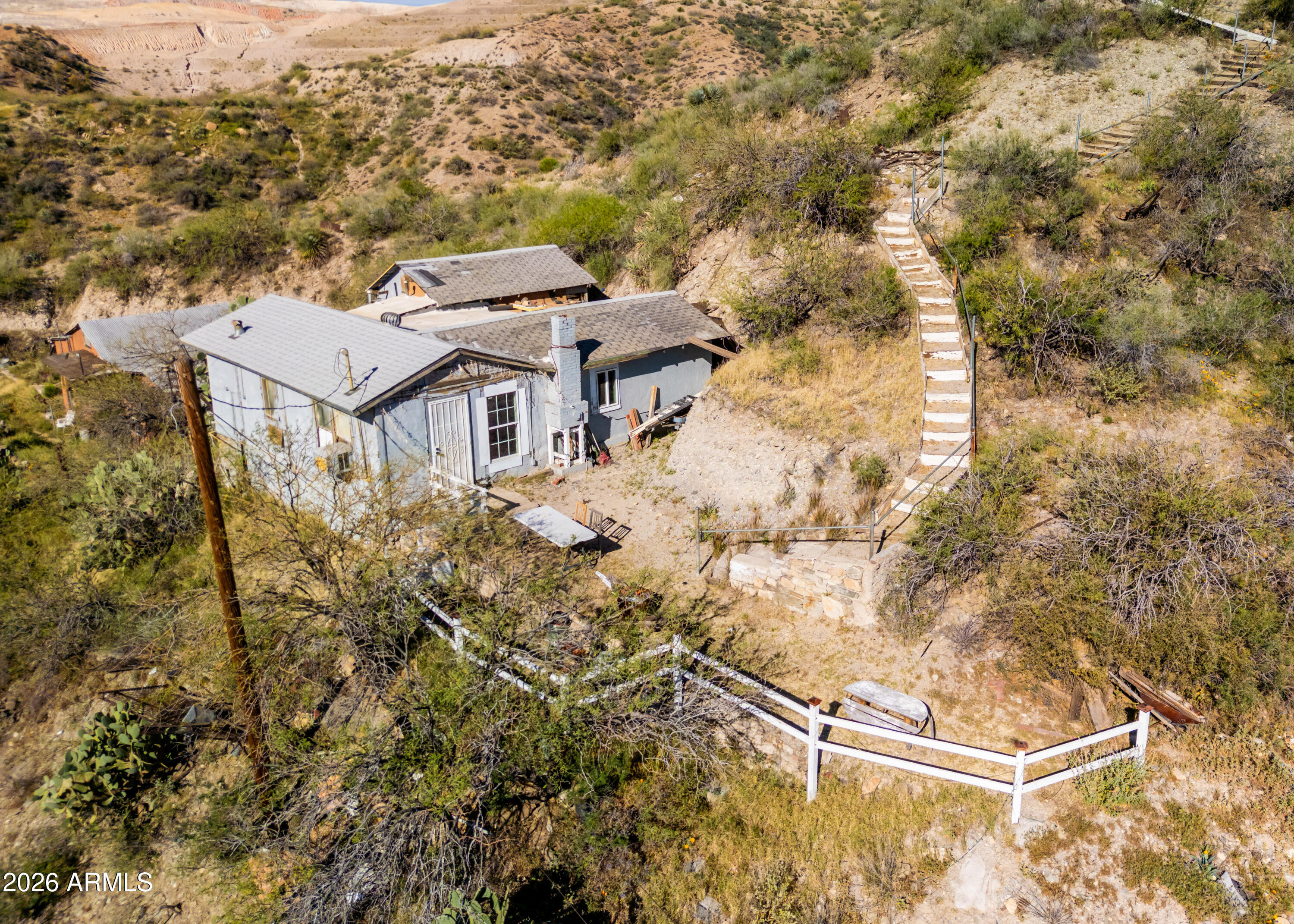 512 West Pinto Street Miami, AZ 85539 - Photo 8 of 27 an aerial view of a house with a yard and mountain view in back
