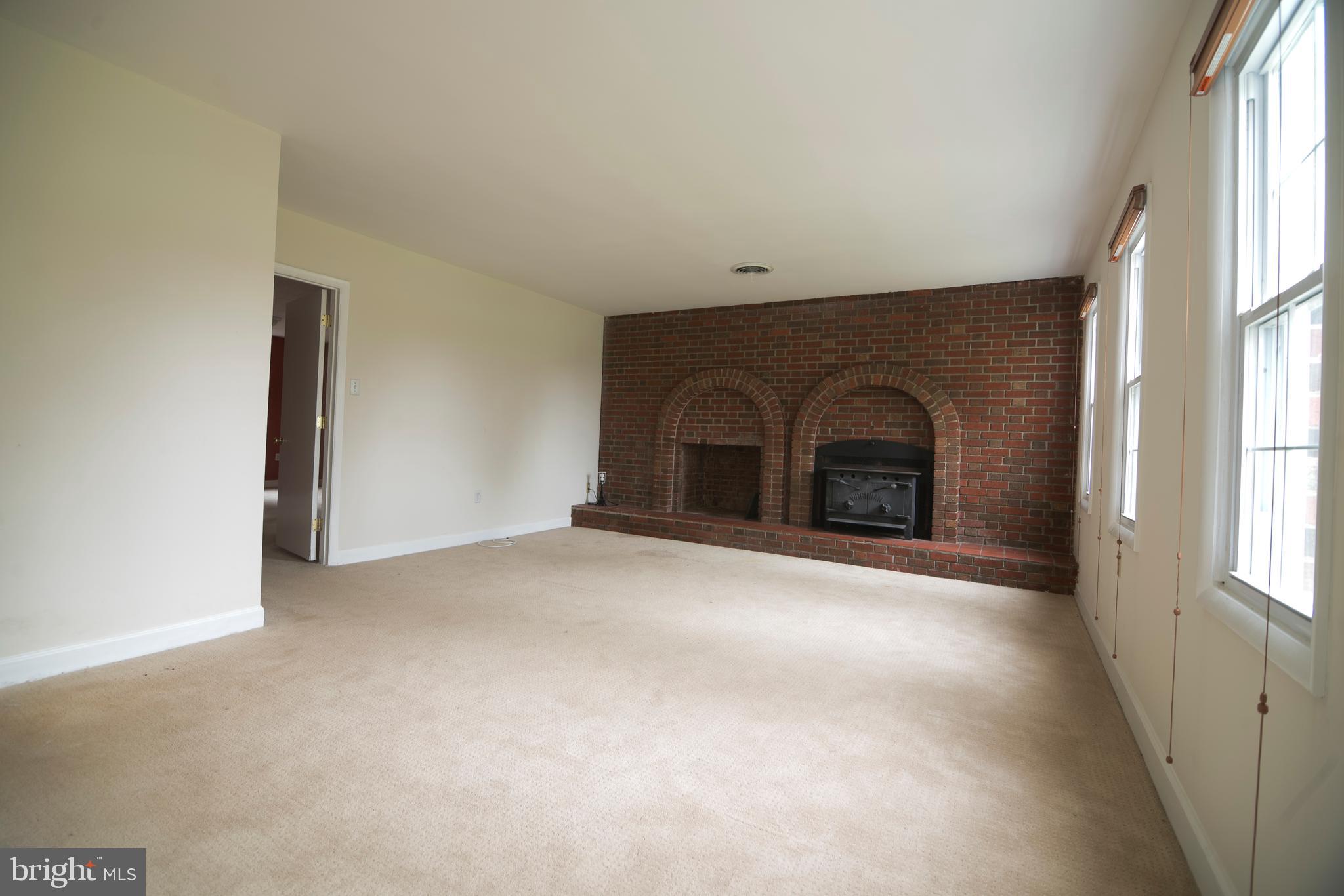 4533 Green Valley Road Monrovia, MD 21770 - Photo 10 of 27 Down stairs wood stove and wood storage
