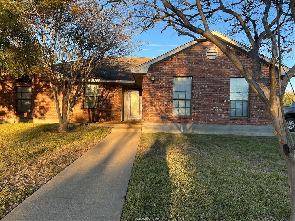 4611 Brompton Lane Bryan, TX 77802 - Photo 1 of 18 Single story home with a front lawn and brick siding
