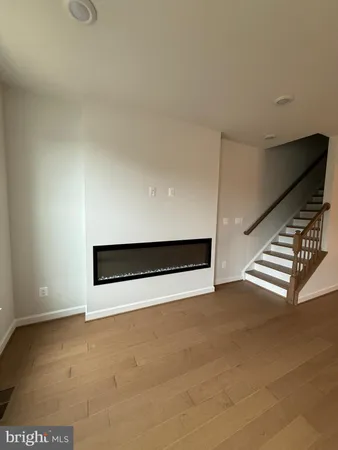 a view of an empty room with stairs