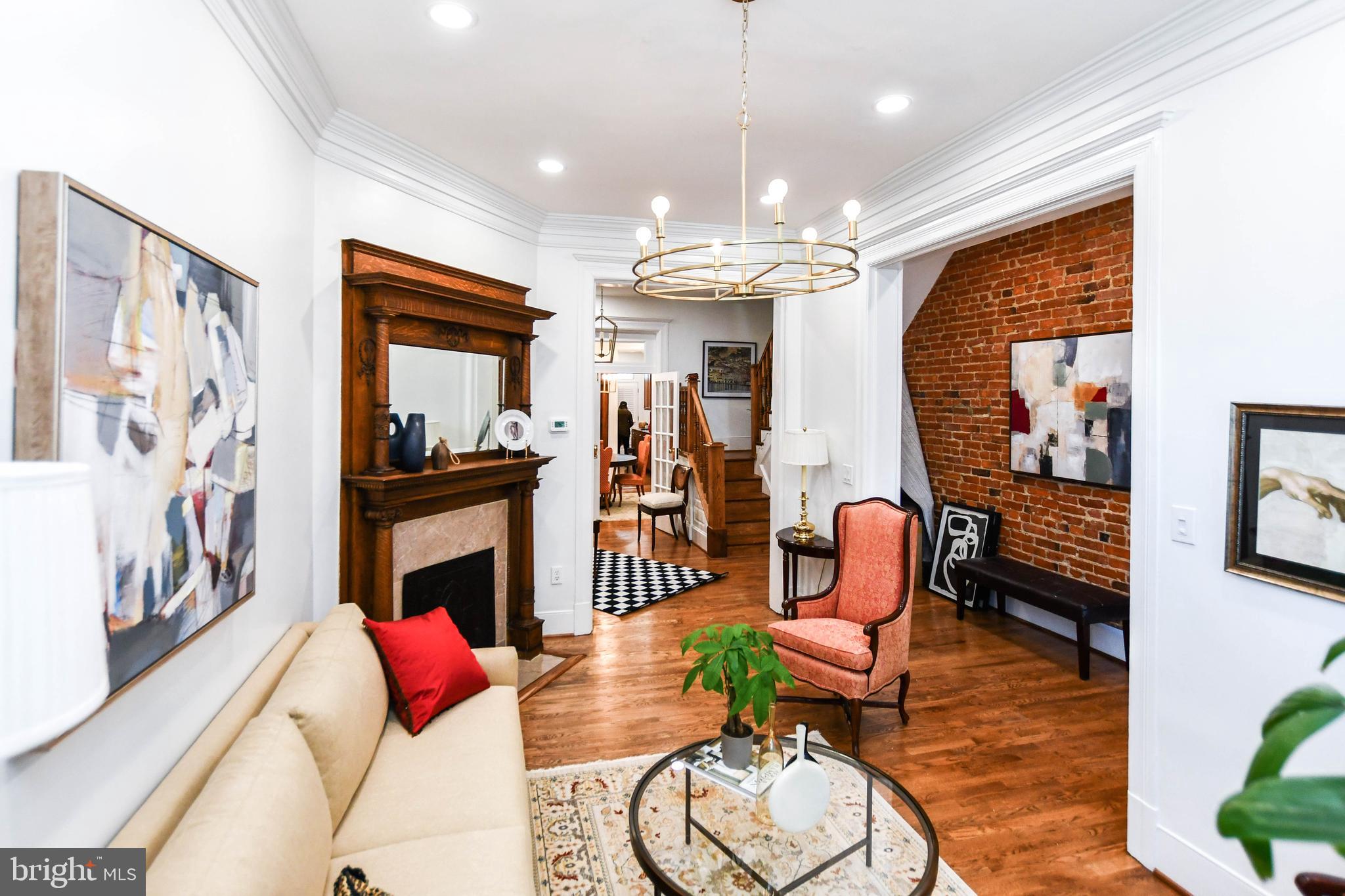 34 R Street Northeast Washington, DC 20002 - Photo 11 of 74 a living room with furniture and a chandelier