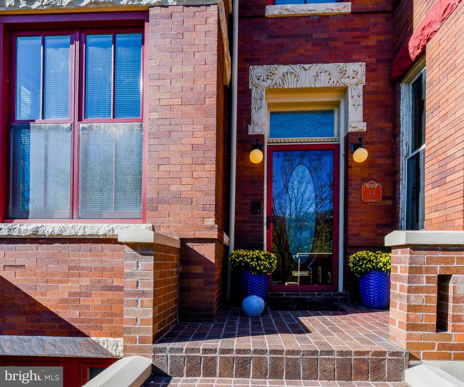 34 R Street Northeast Washington, DC 20002 - Photo 4 of 74 a view of a brick house with a potted plant and a window