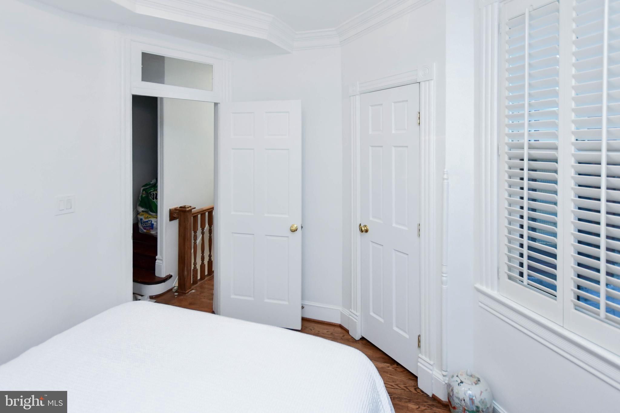 34 R Street Northeast Washington, DC 20002 - Photo 42 of 74 a bedroom with a bed and a mirror