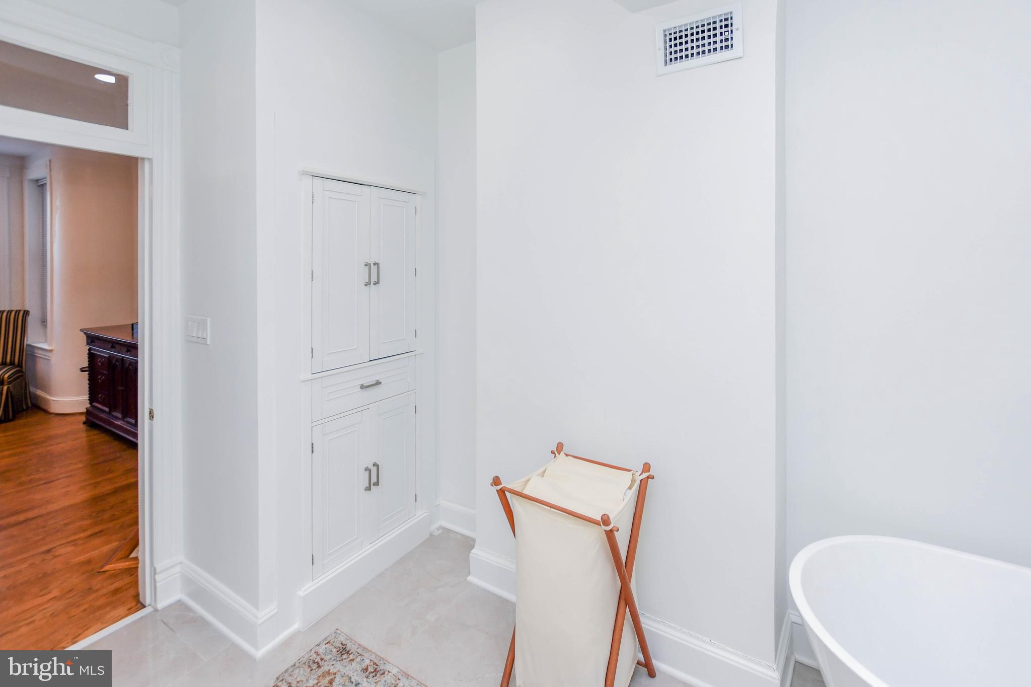 34 R Street Northeast Washington, DC 20002 - Photo 58 of 74 a bathroom with a tub and shower