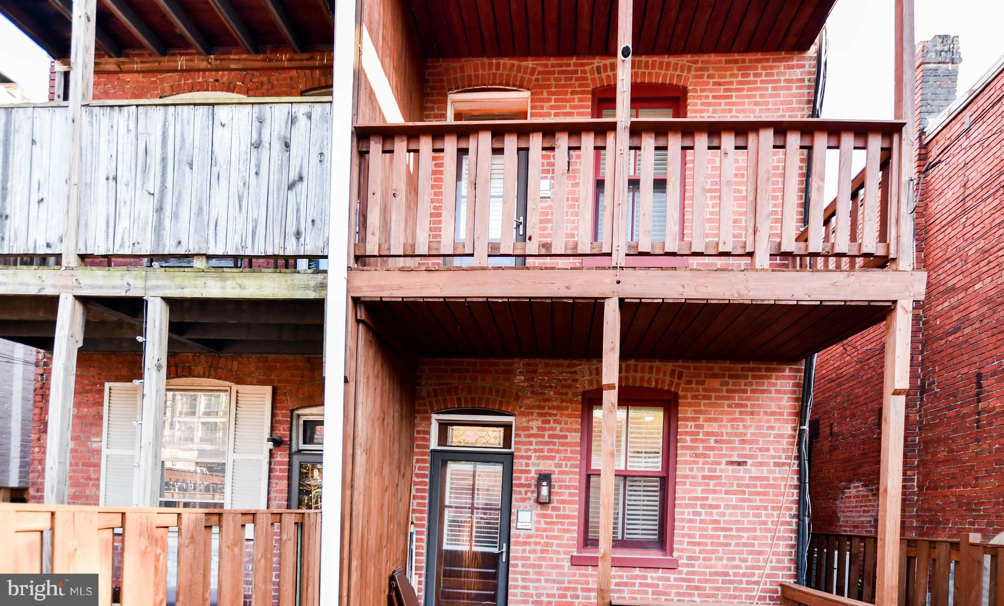 34 R Street Northeast Washington, DC 20002 - Photo 61 of 74 a view of a balcony with furniture and wooden floor