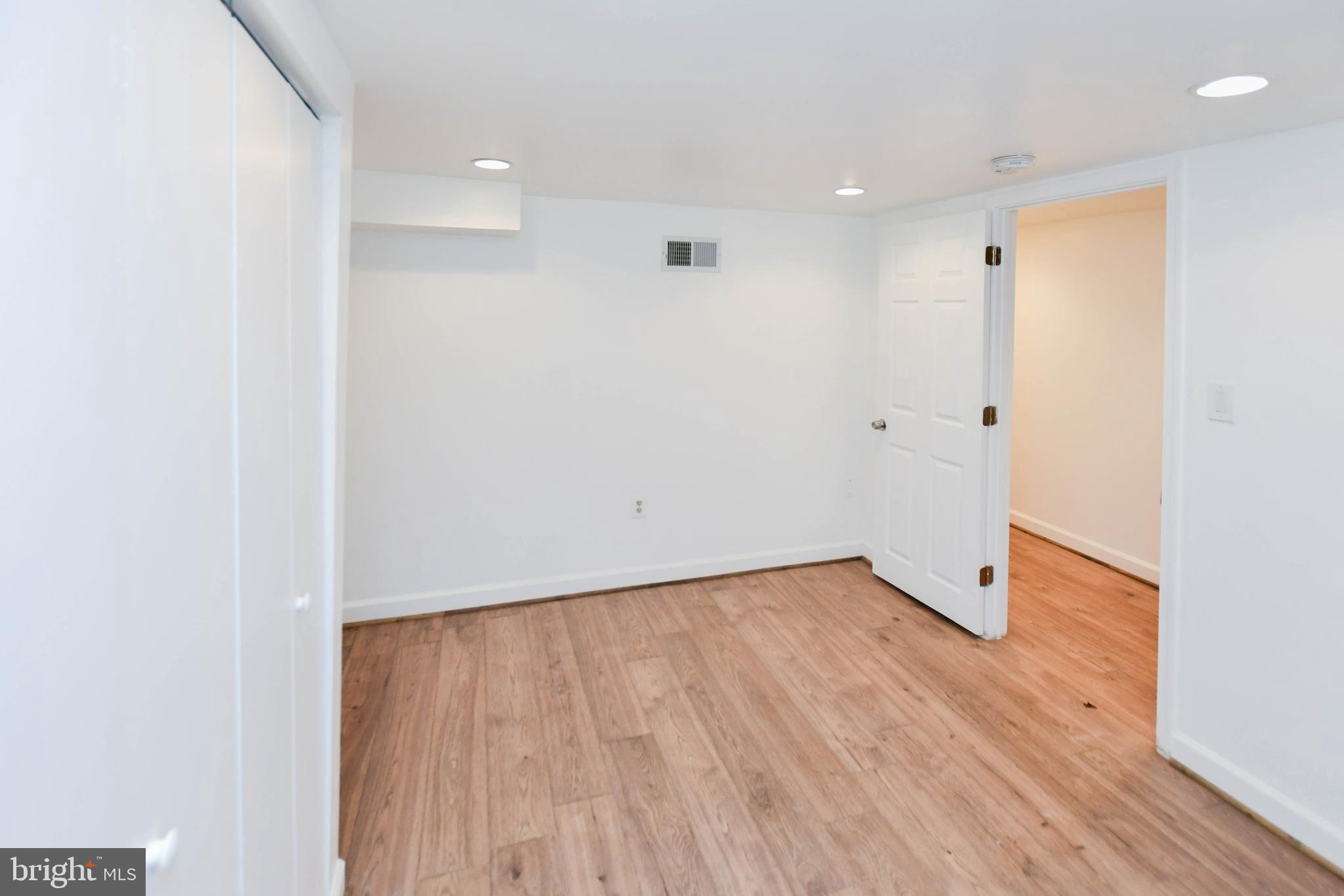 34 R Street Northeast Washington, DC 20002 - Photo 63 of 74 a view of an empty room with wooden floor
