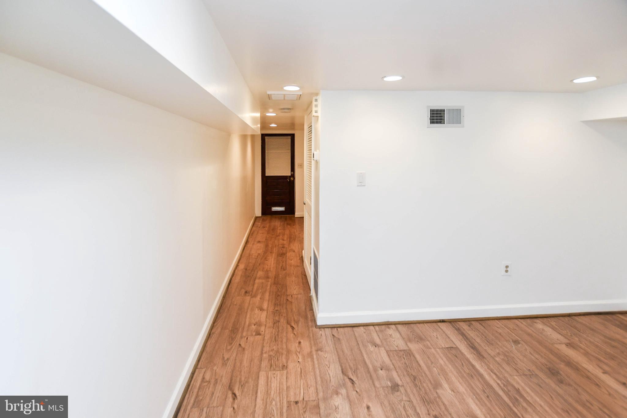 34 R Street Northeast Washington, DC 20002 - Photo 65 of 74 a view of a hallway with wooden floor