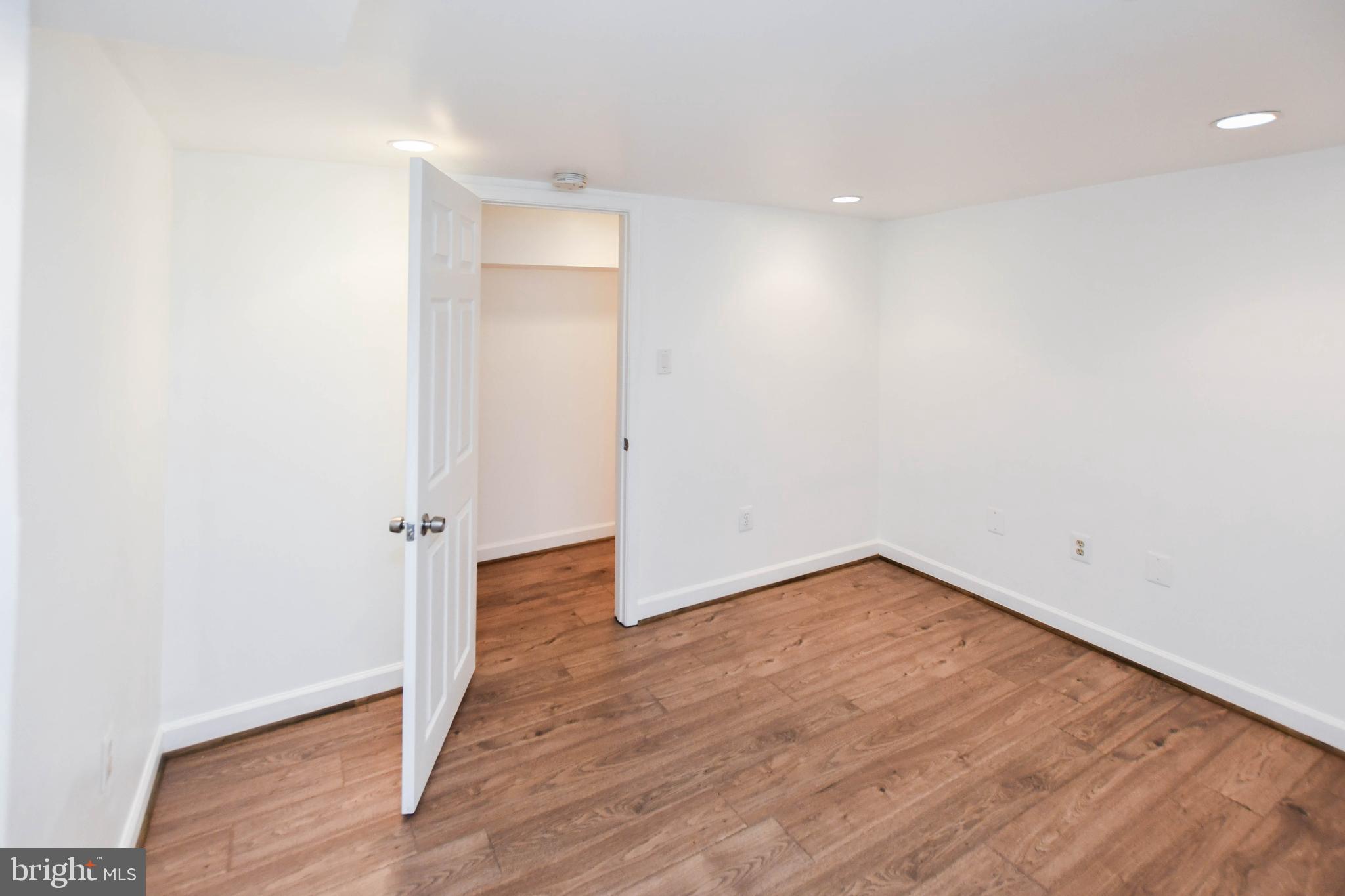 34 R Street Northeast Washington, DC 20002 - Photo 67 of 74 a view of an empty room with wooden floor