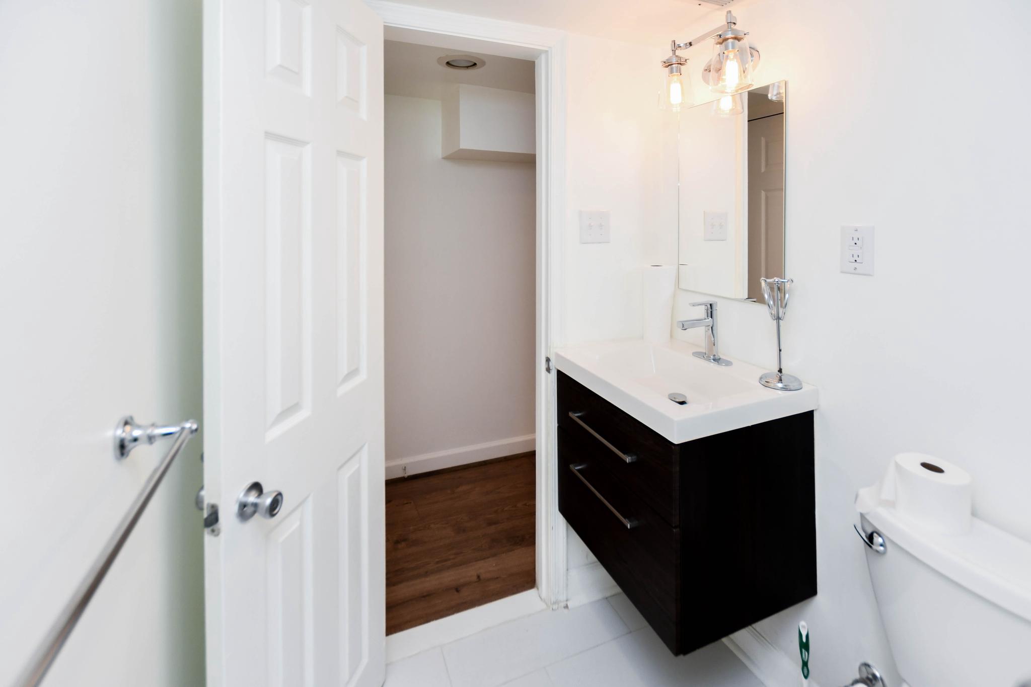 34 R Street Northeast Washington, DC 20002 - Photo 71 of 74 a bathroom with a sink and a mirror