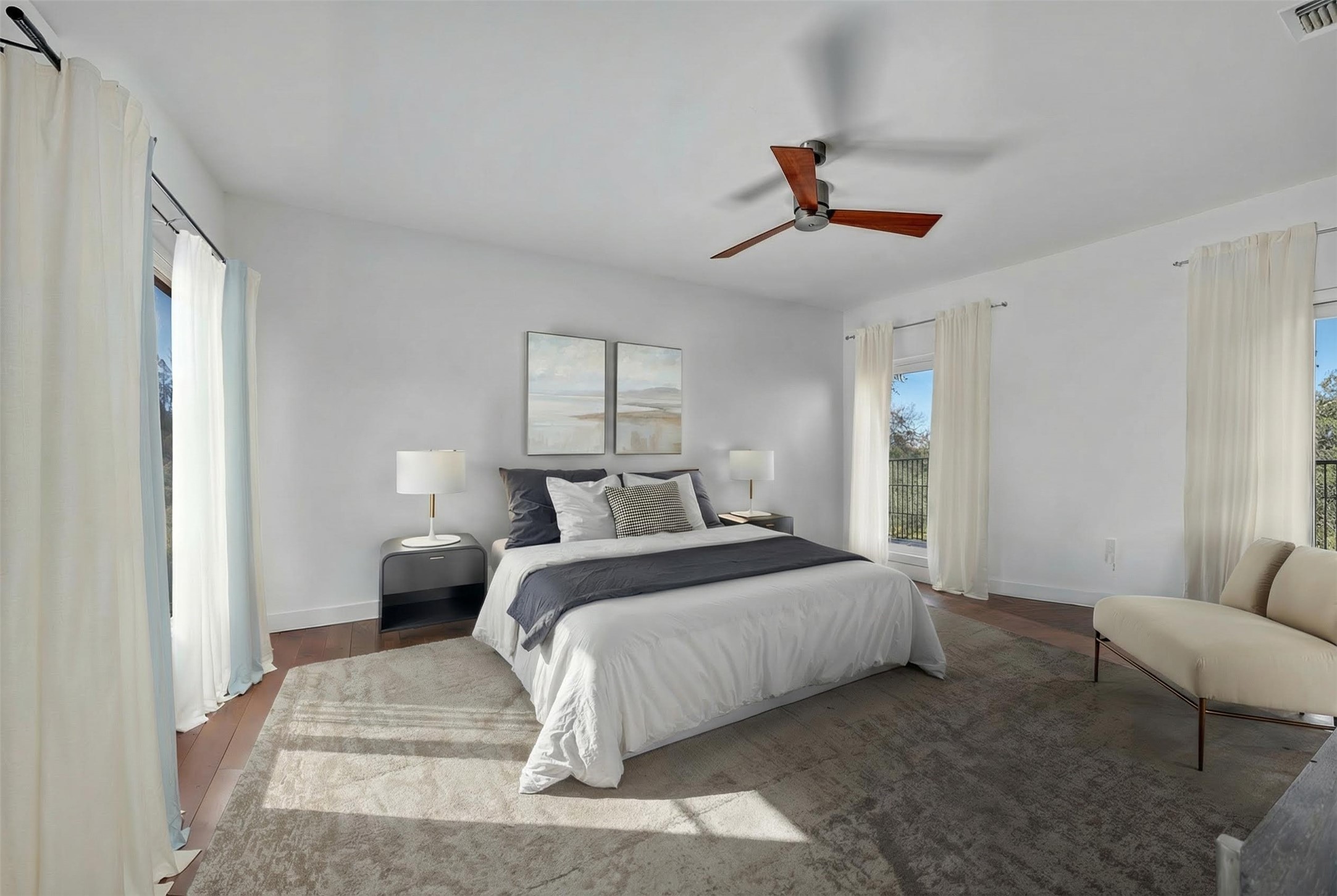 24710 Fossil Trail Spicewood, TX 78669 - Photo 15 of 40 a bedroom with a bed a couch and a couch