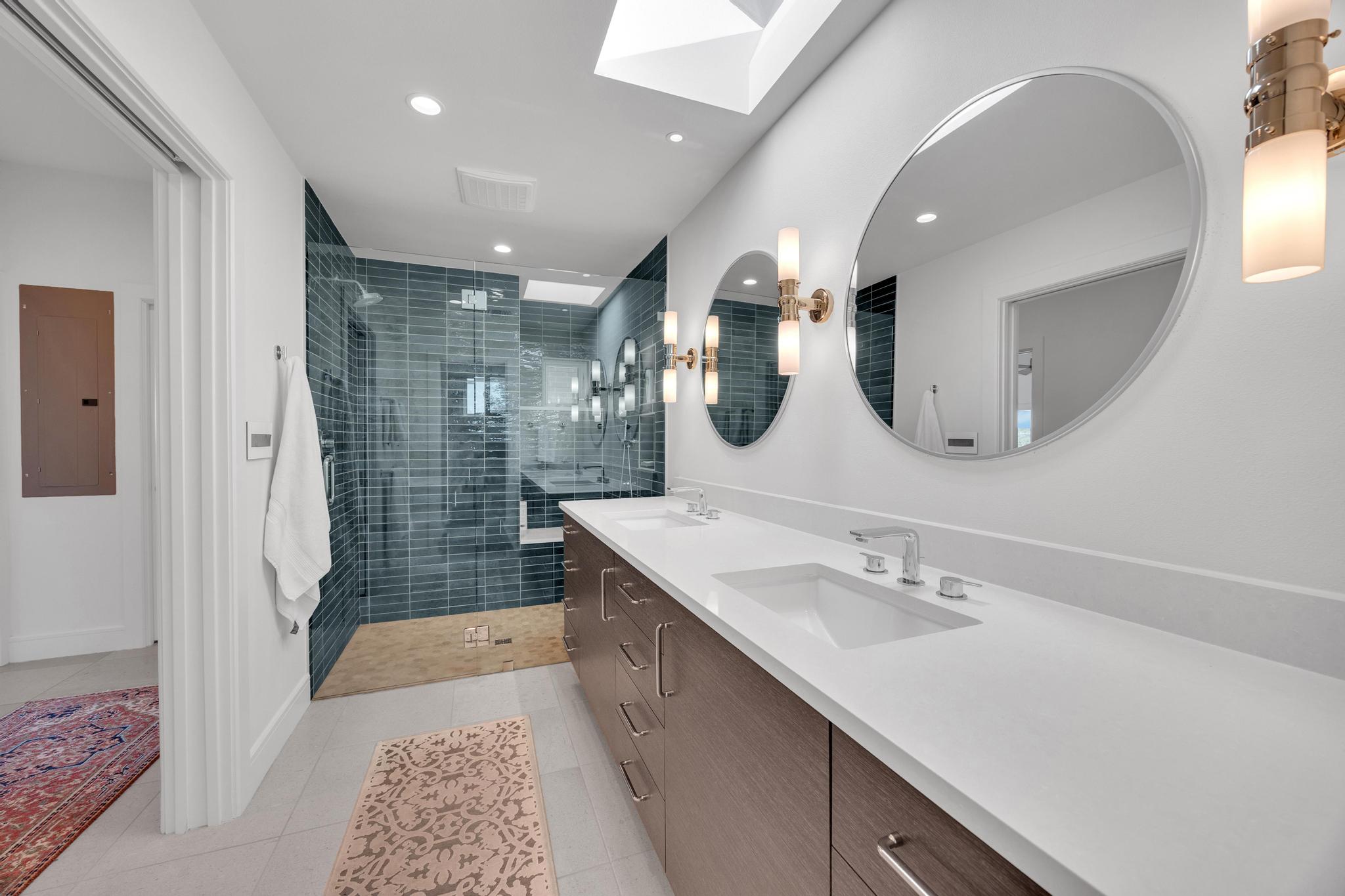 24710 Fossil Trail Spicewood, TX 78669 - Photo 17 of 40 a bathroom with a sink a toilet and shower