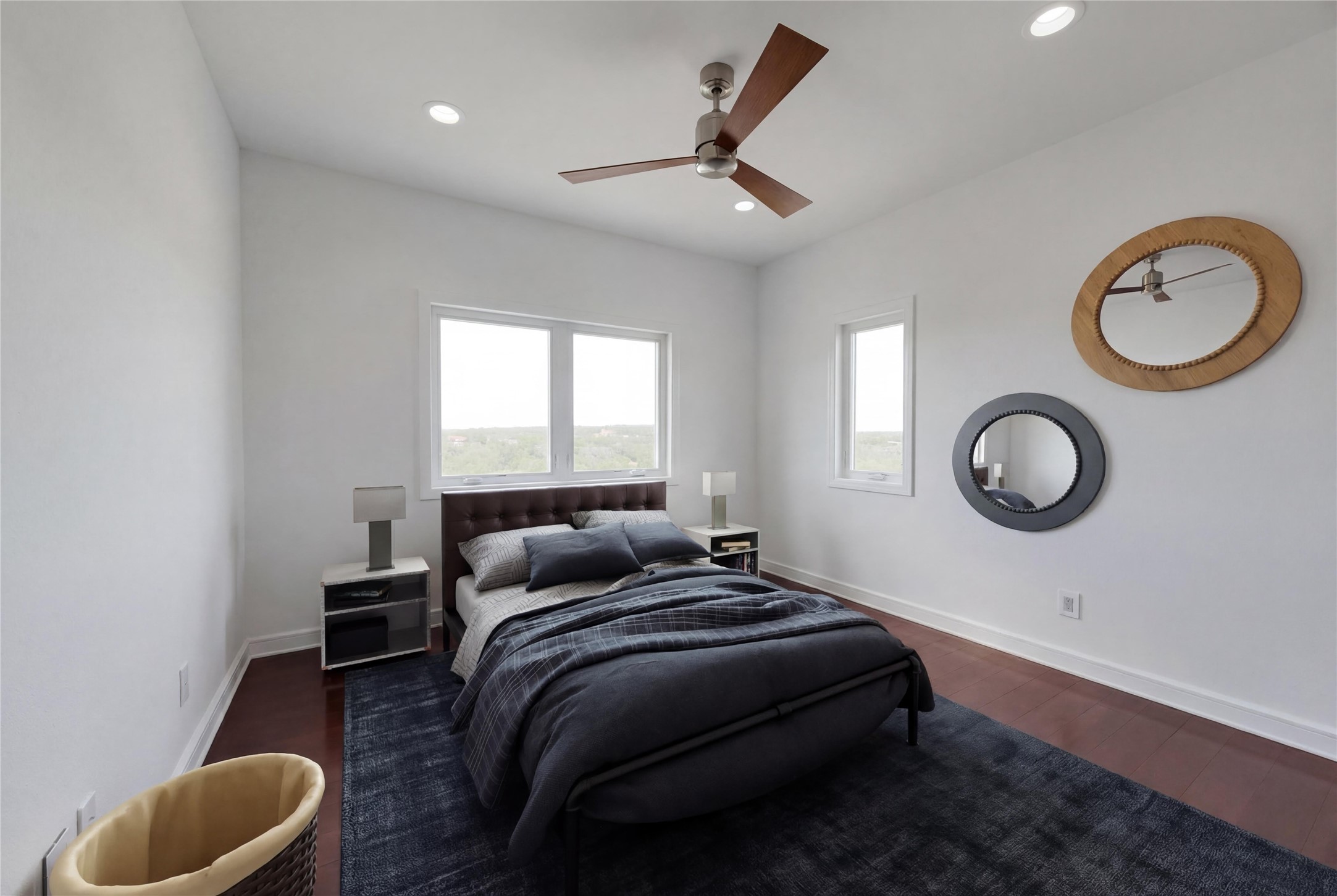 24710 Fossil Trail Spicewood, TX 78669 - Photo 21 of 40 a bedroom with a bed and a wall painting