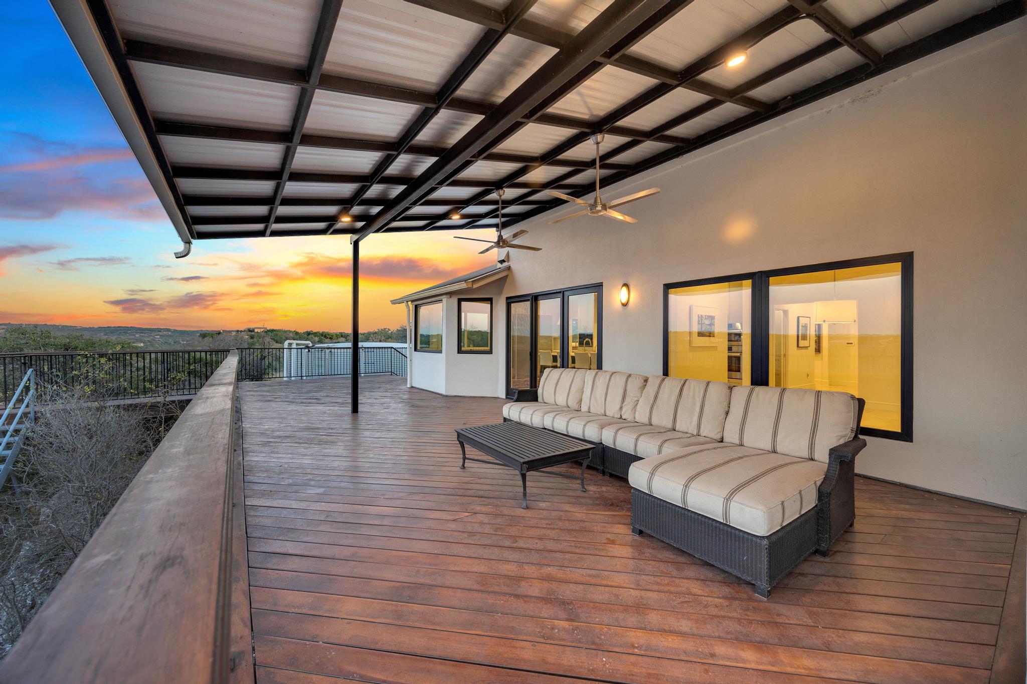 24710 Fossil Trail Spicewood, TX 78669 - Photo 23 of 40 a balcony with furniture