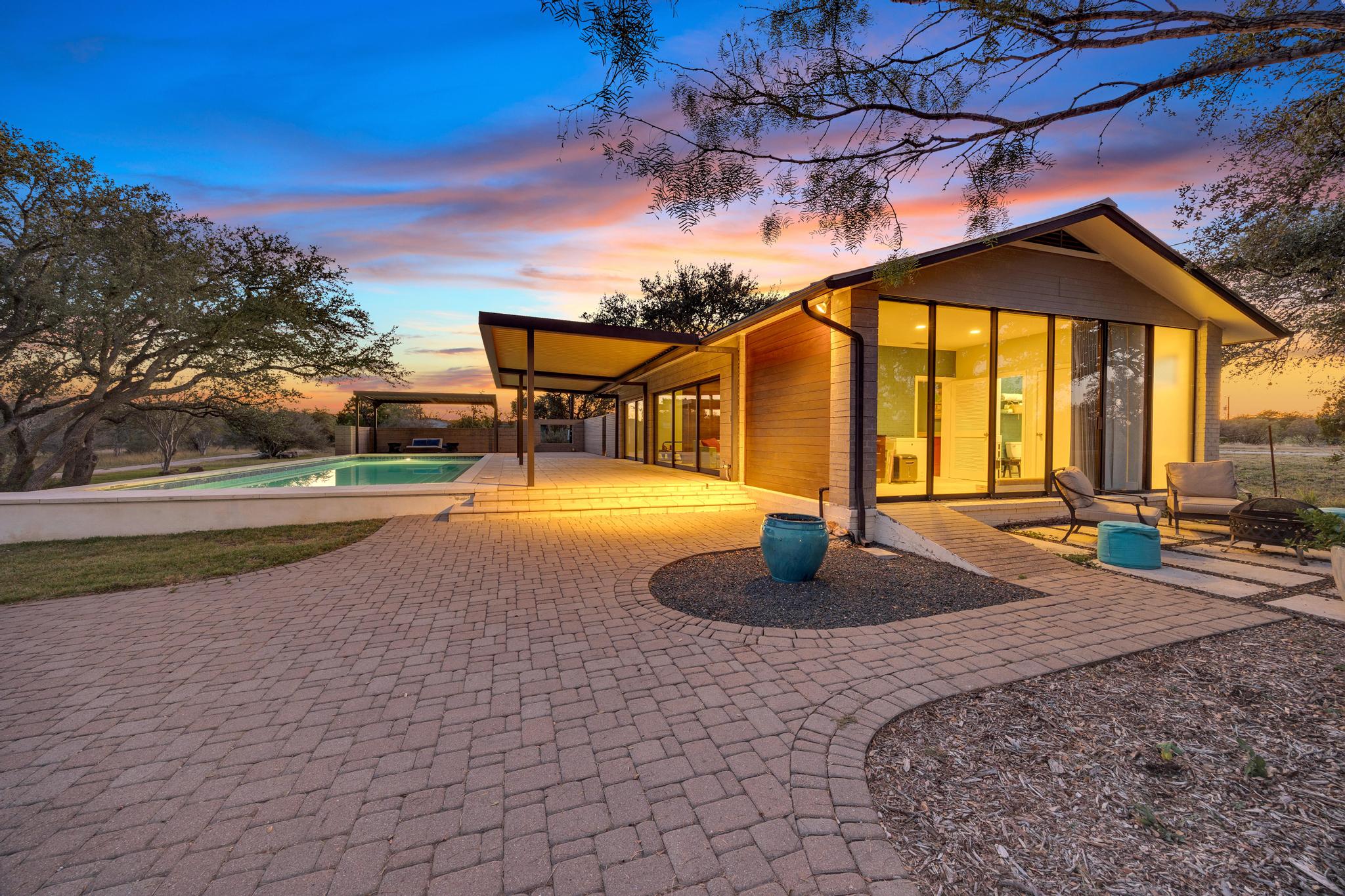 24710 Fossil Trail Spicewood, TX 78669 - Photo 24 of 40 a view of tall trees with a yard
