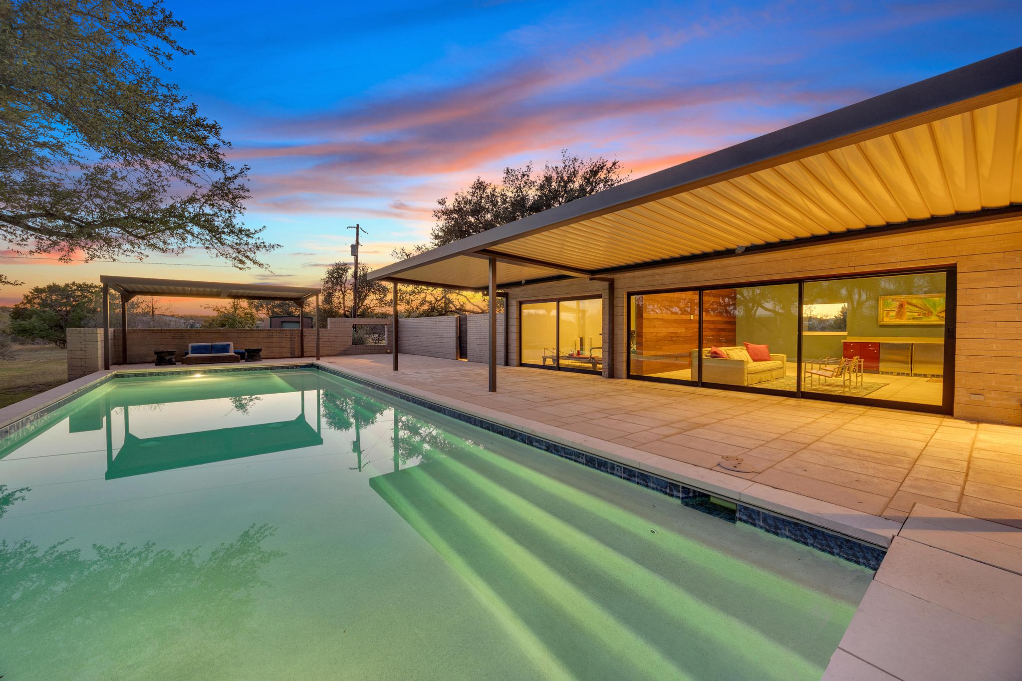 24710 Fossil Trail Spicewood, TX 78669 - Photo 25 of 40 a view of swimming pool with a yard