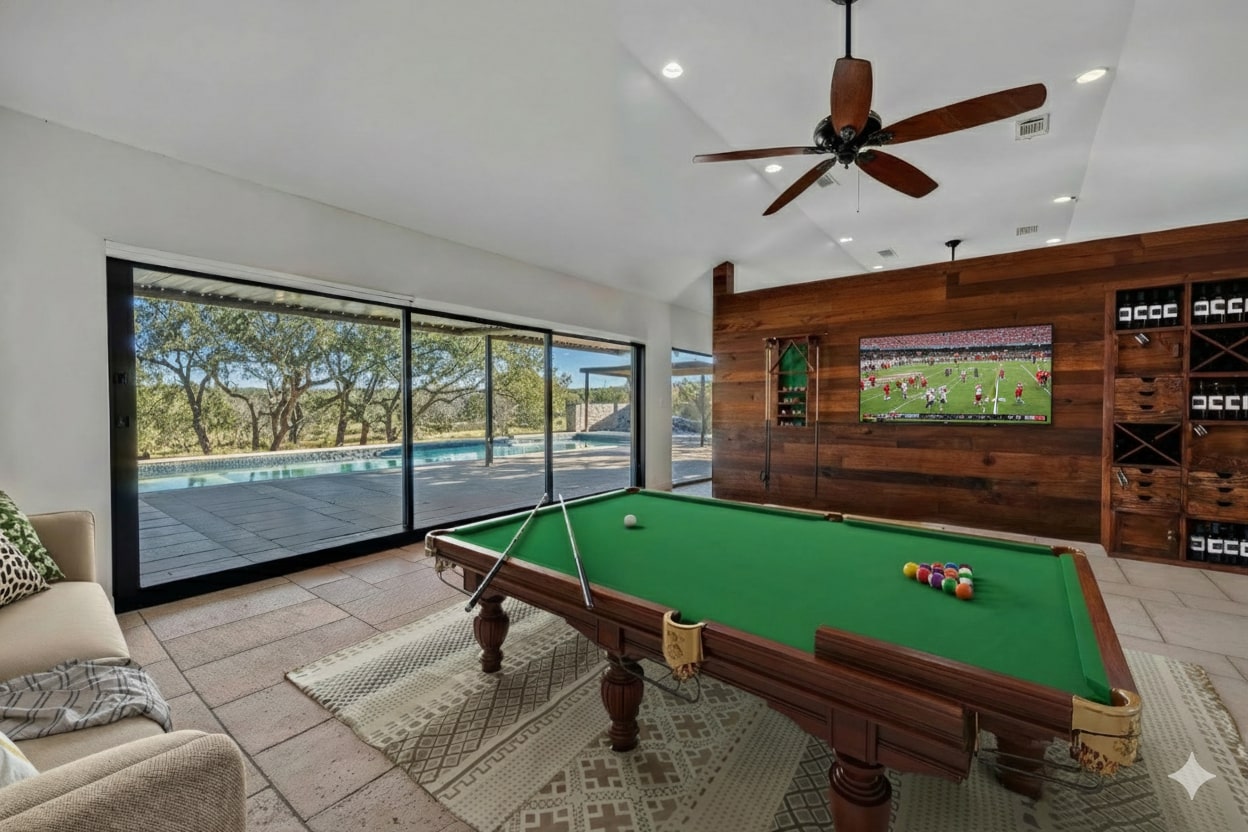 24710 Fossil Trail Spicewood, TX 78669 - Photo 28 of 40 a room with pool table and windows