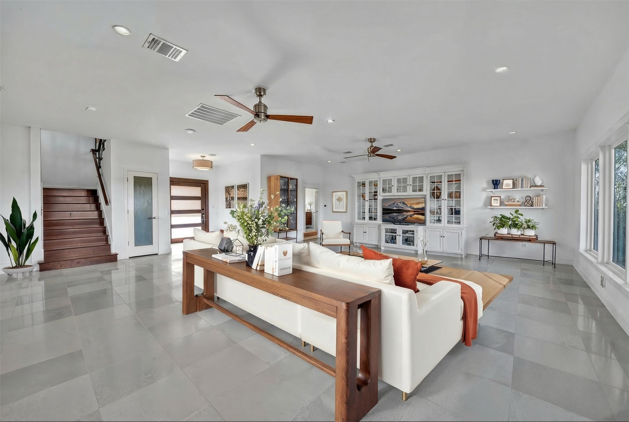 24710 Fossil Trail Spicewood, TX 78669 - Photo 6 of 40 a living room with furniture and a wooden floor