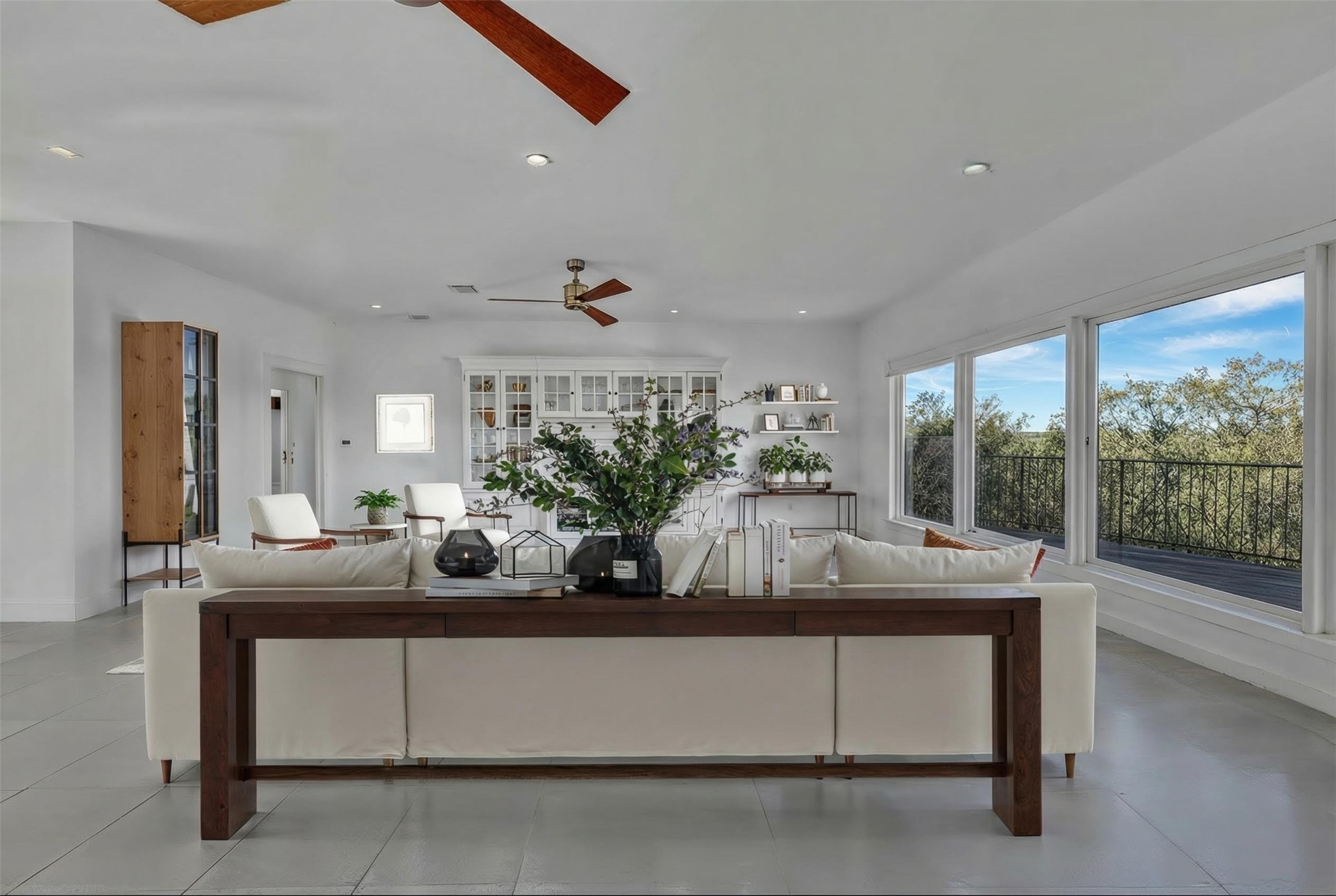 24710 Fossil Trail Spicewood, TX 78669 - Photo 7 of 40 a dining room with furniture and a potted plant