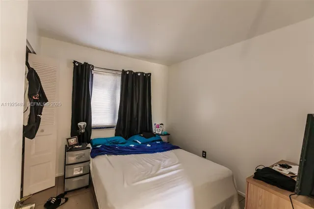 a room with a closet and a mirror