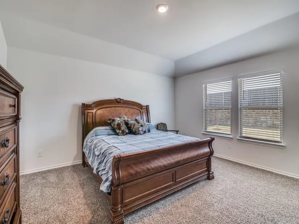 a bedroom with a bed and a closet