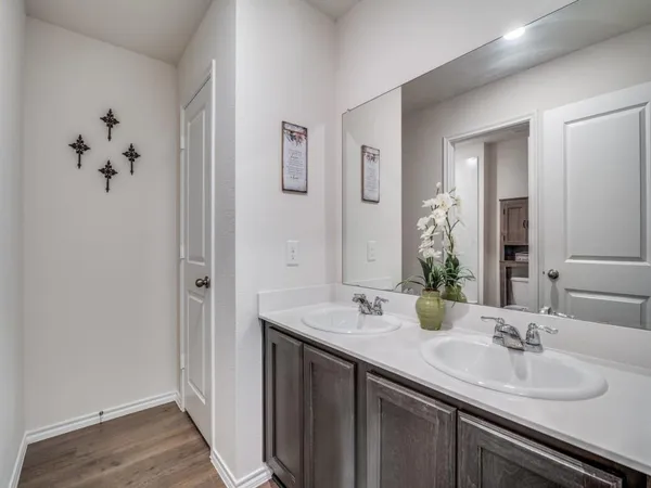 a view of hallway with wooden floor