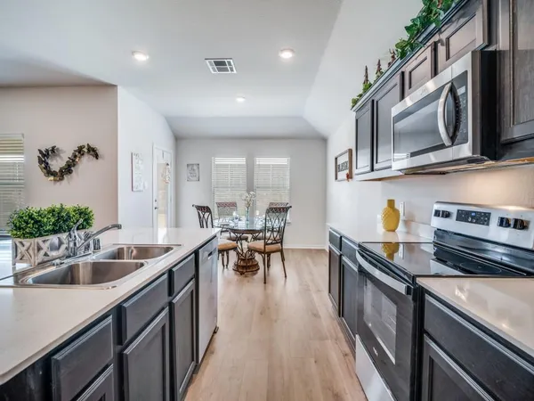 a view of a house with chairs and sitting area