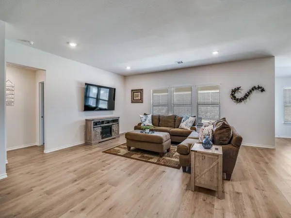 a living room with furniture and a table