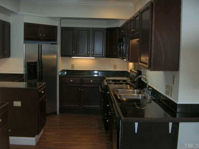 3803 Cole Mill Road Durham, NC 27712 - Photo 2 of 8 Beautiful and functional cook's kitchen, with under counter lighting, solid surface counter tops, cherry cabinets and lots of storage. Other