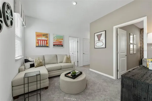 a living room with furniture and a window