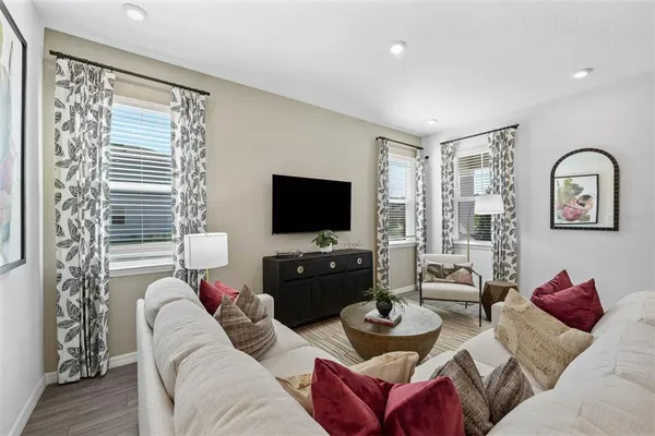 a living room with furniture and a rug