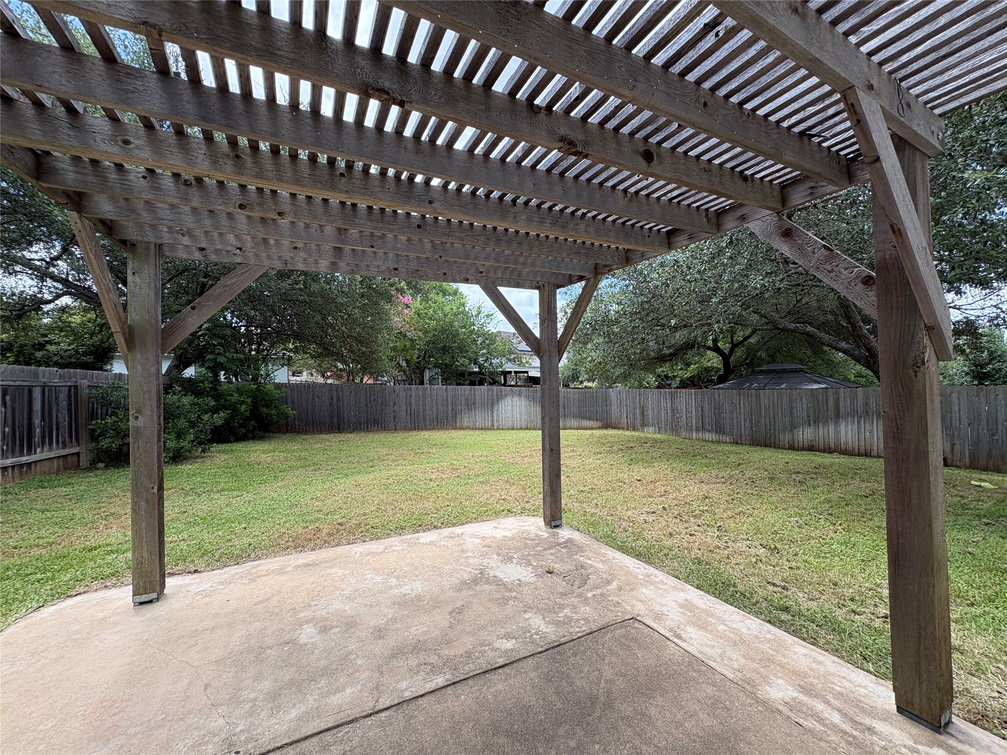 8103 Ephraim Road Austin, TX 78717 - Photo 35 of 35 A spacious private yard awaits, complete with a covered patio perfect for outdoor enjoyment.