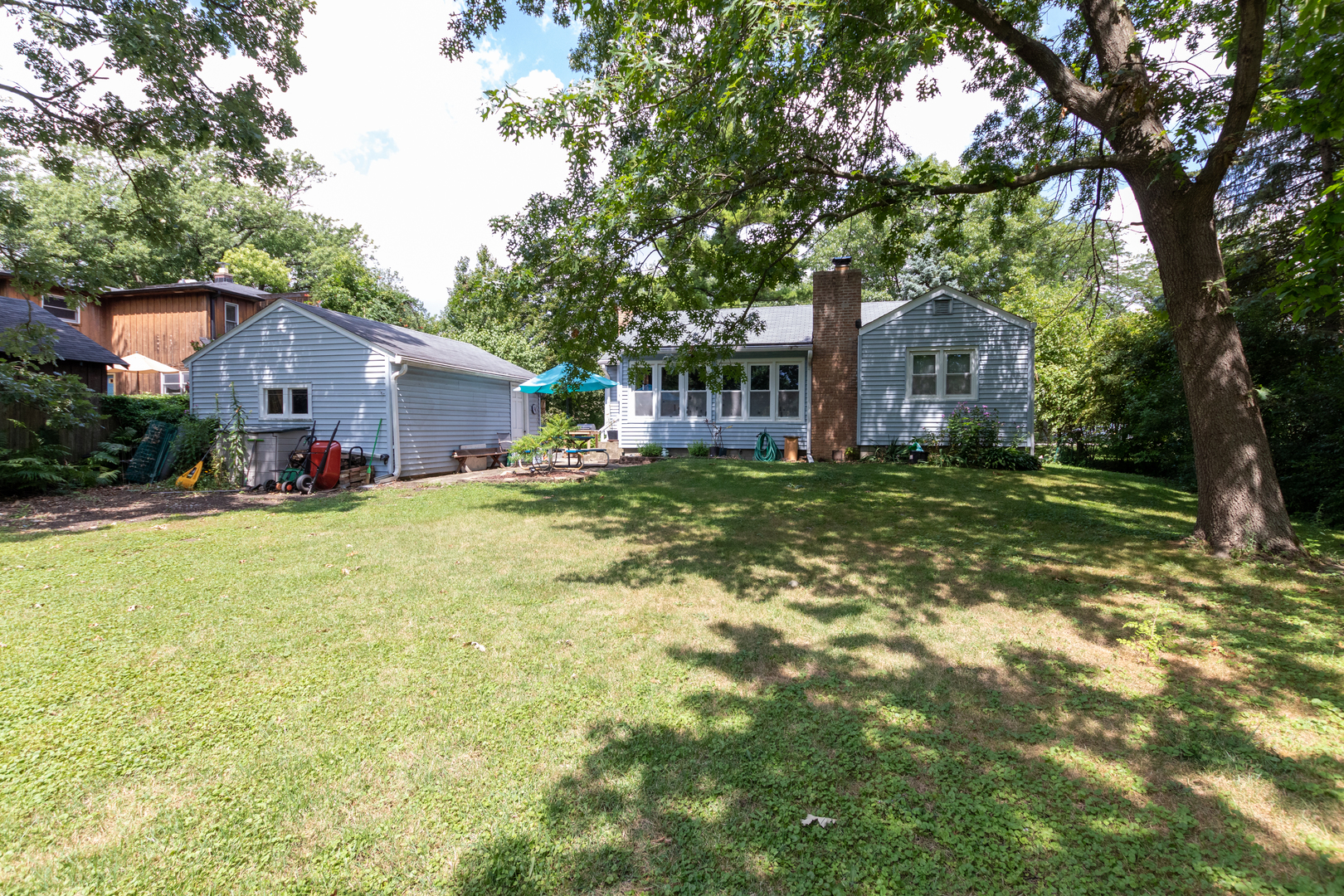 2941 Birch Road Homewood, IL 60430 - Photo 15 of 15 a view of a house with a big yard and large trees