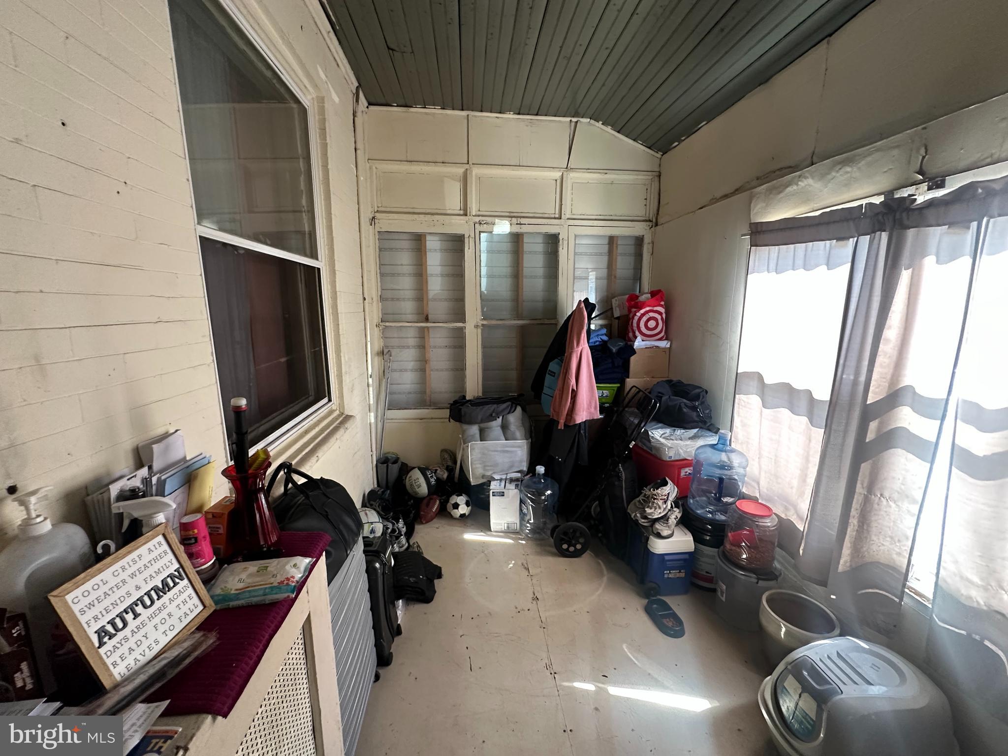 5024 Duffield Street Philadelphia, PA 19124 - Photo 2 of 18 a room with furniture a window and gym equipment