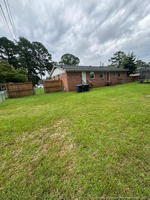 Undisclosed Address Raeford, NC 28376 - Photo 12 of 12 a view of a house with a big yard