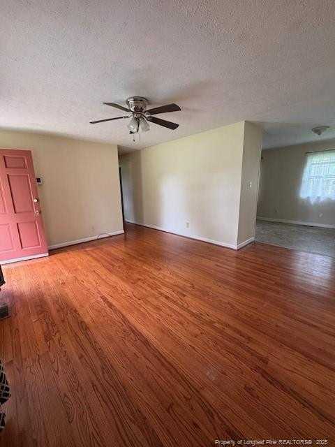 Undisclosed Address Raeford, NC 28376 - Photo 2 of 12 a view of empty room with wooden floor