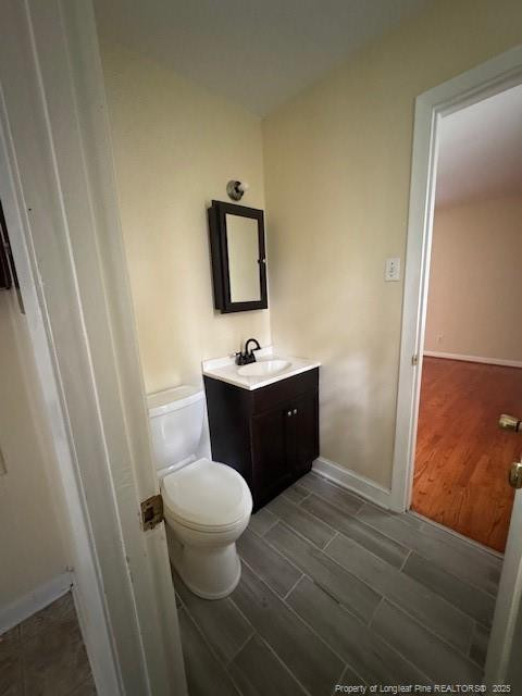 Undisclosed Address Raeford, NC 28376 - Photo 9 of 12 a bathroom with a sink vanity mirror and toilet