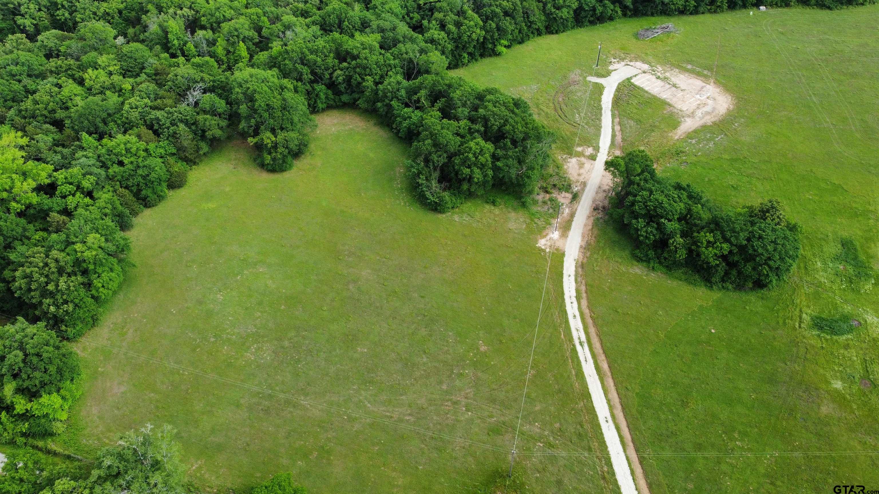 388 C R 3160 Emory, TX 75440 - Photo 2 of 13 a view of a lake with a yard