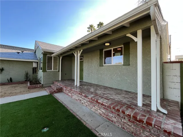 a house view with a backyard space