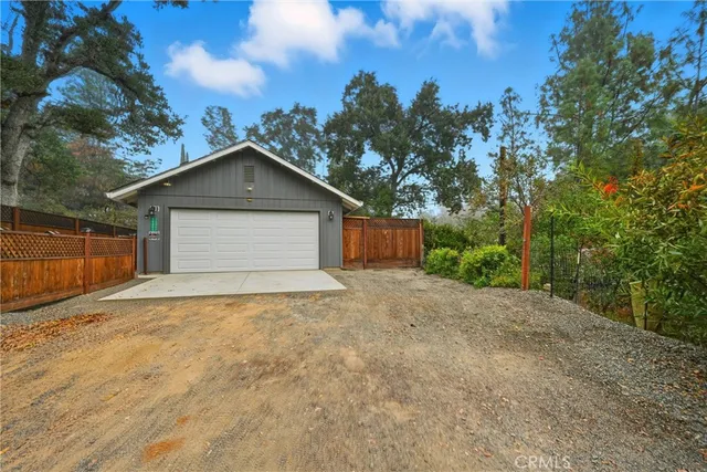 a front view of house with garage and yard