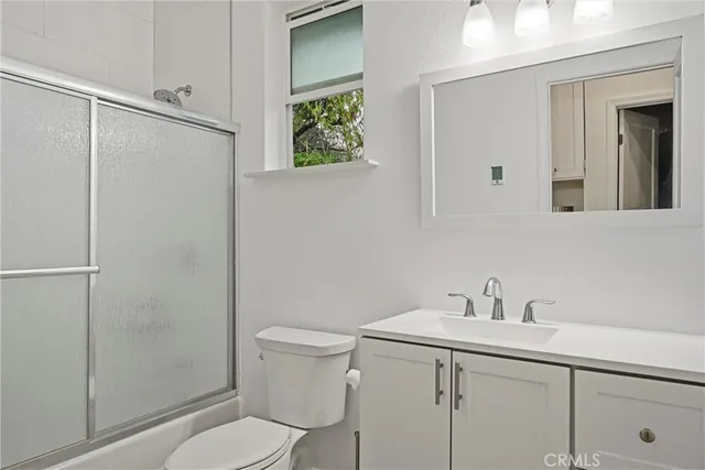 a bathroom with a sink toilet and vanity