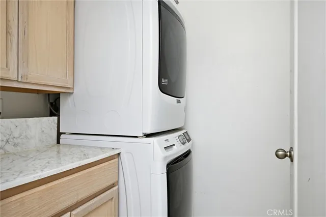 a close view of a utility room with dryer and washer