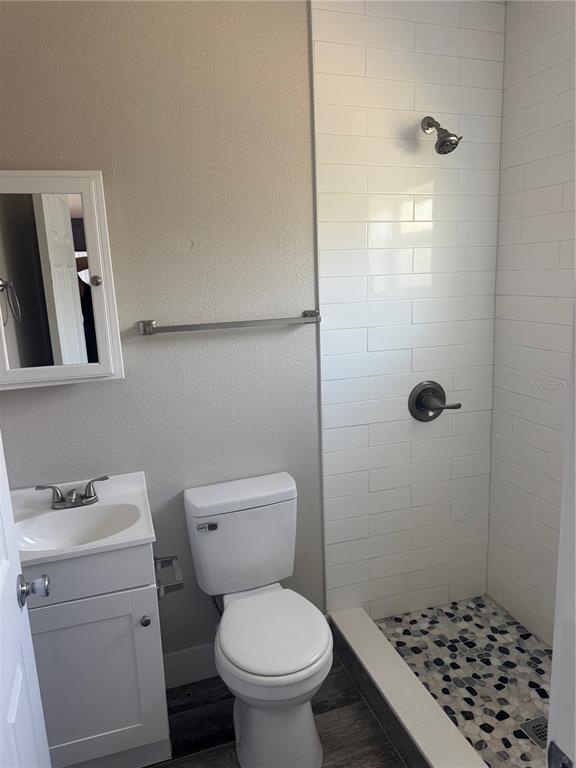 1896 Ocean Shore Boulevard Ormond Beach, FL 32176 - Photo 5 of 6 a bathroom with a toilet and a shower