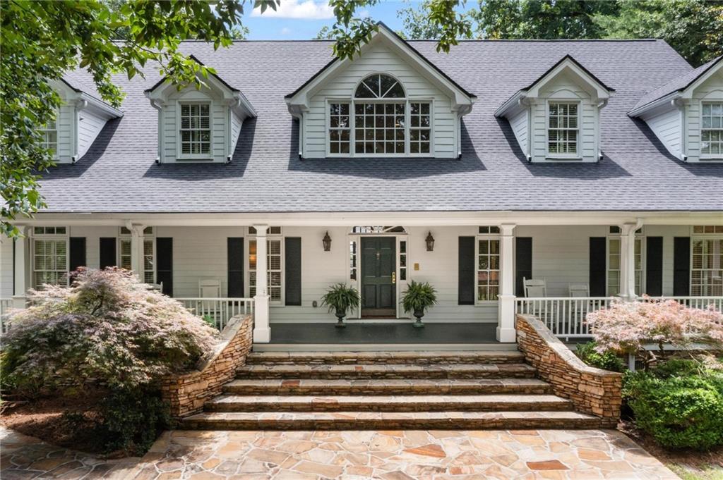 1824 Mt Paran Road Northwest Atlanta, GA 30327 - Photo 1 of 1 a front view of a house with a yard
